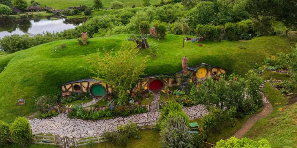 The iconic hobbit holes of Hobbiton Movie Set recreated in permanent detail near Matamata, New Zealand